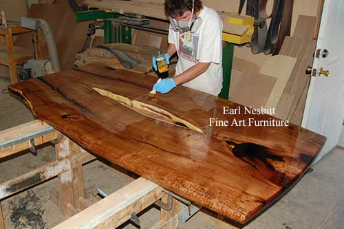 Earl oiling this unique live edge table